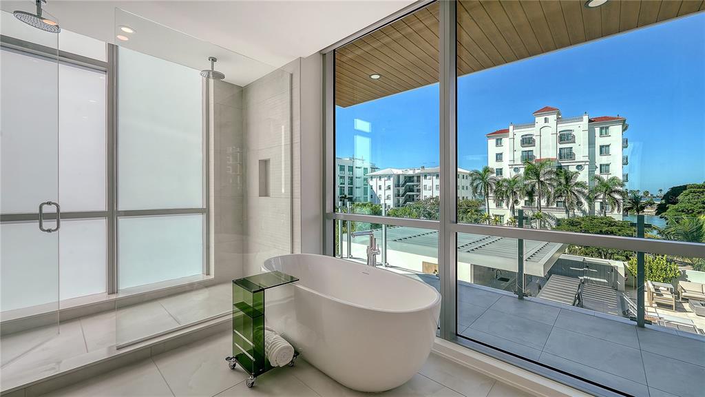 111 Golden Gate Point, Unit 201 Sarasota, FL 34236 - Photo 24 of 64 a living room with furniture and a potted plant