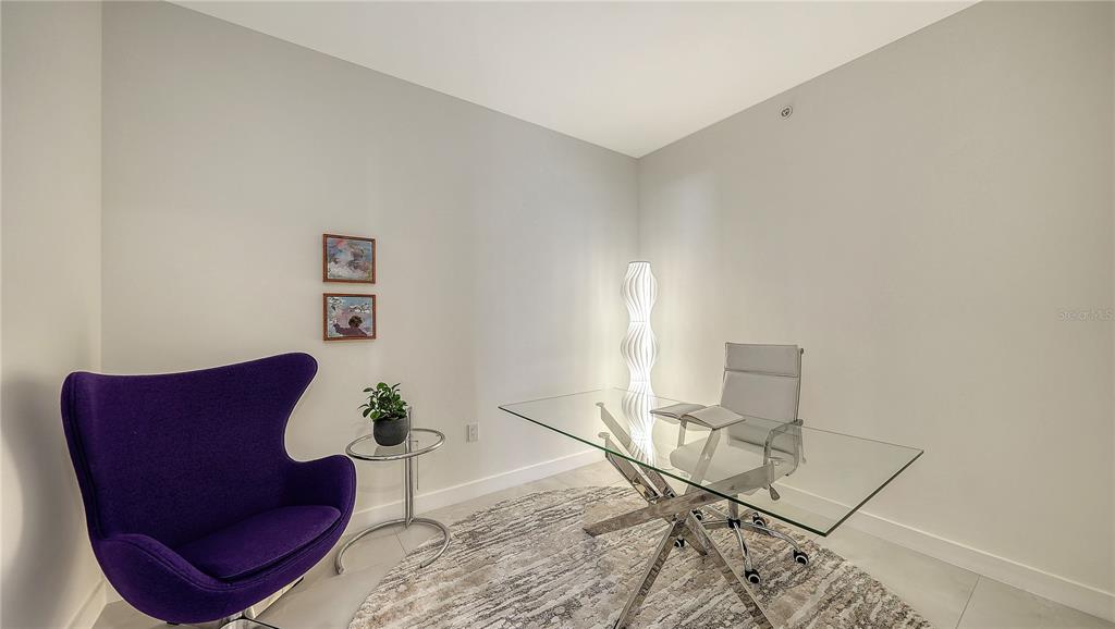 111 Golden Gate Point, Unit 201 Sarasota, FL 34236 - Photo 31 of 64 a view of a livingroom with furniture and a table