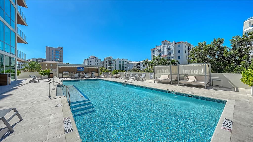 111 Golden Gate Point, Unit 201 Sarasota, FL 34236 - Photo 38 of 64 a view of a swimming pool and a terrace