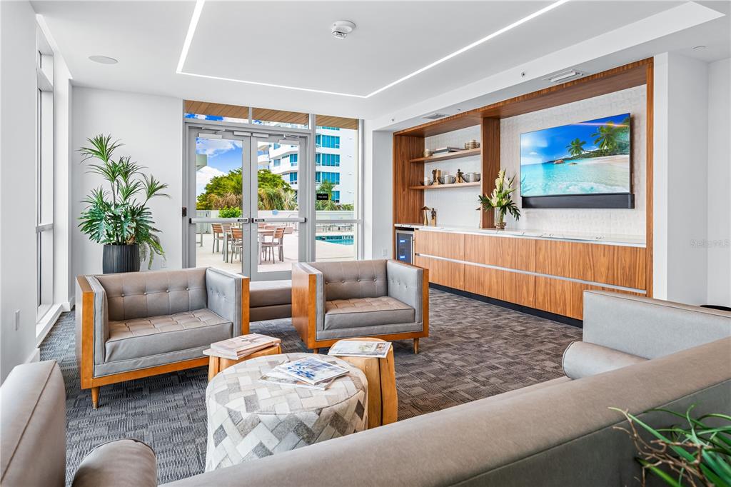 111 Golden Gate Point, Unit 201 Sarasota, FL 34236 - Photo 42 of 64 a living room with furniture and a large window