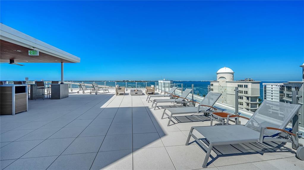 111 Golden Gate Point, Unit 201 Sarasota, FL 34236 - Photo 48 of 64 a view of a terrace with furniture