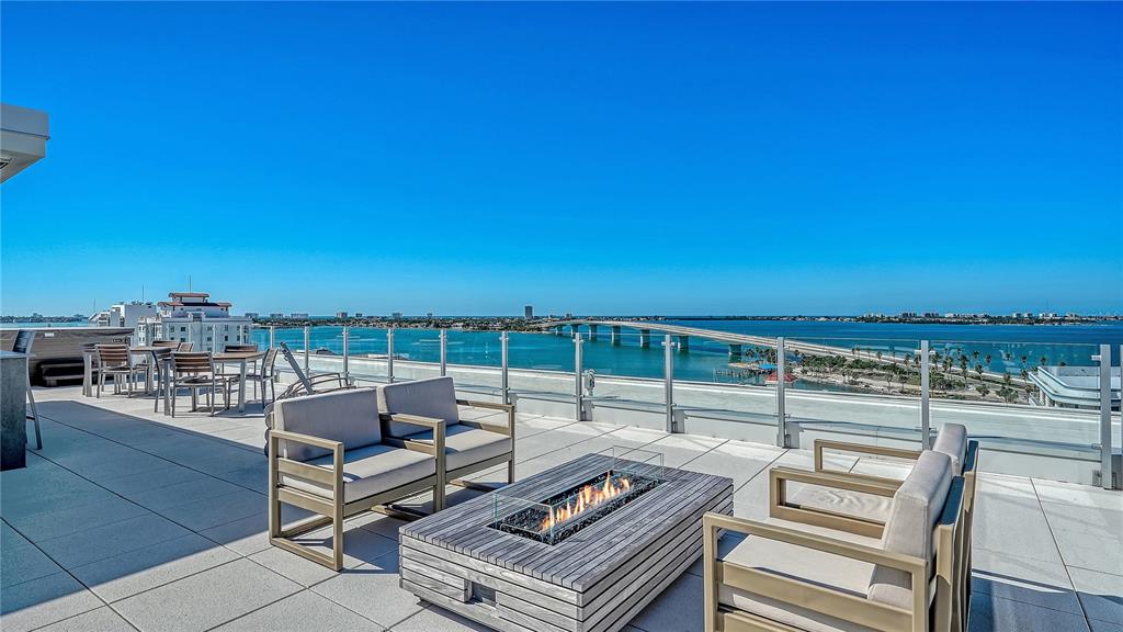 111 Golden Gate Point, Unit 201 Sarasota, FL 34236 - Photo 49 of 64 a view of a terrace with seating area