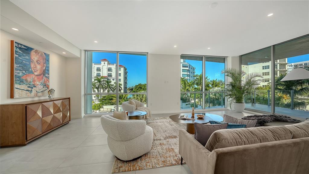 111 Golden Gate Point, Unit 201 Sarasota, FL 34236 - Photo 6 of 64 a living room with furniture and a large window