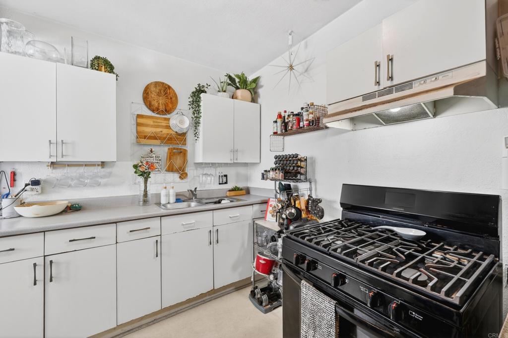 1530 East Appleton Street Long Beach, CA 90802 - Photo 11 of 61 a kitchen with a stove and a sink