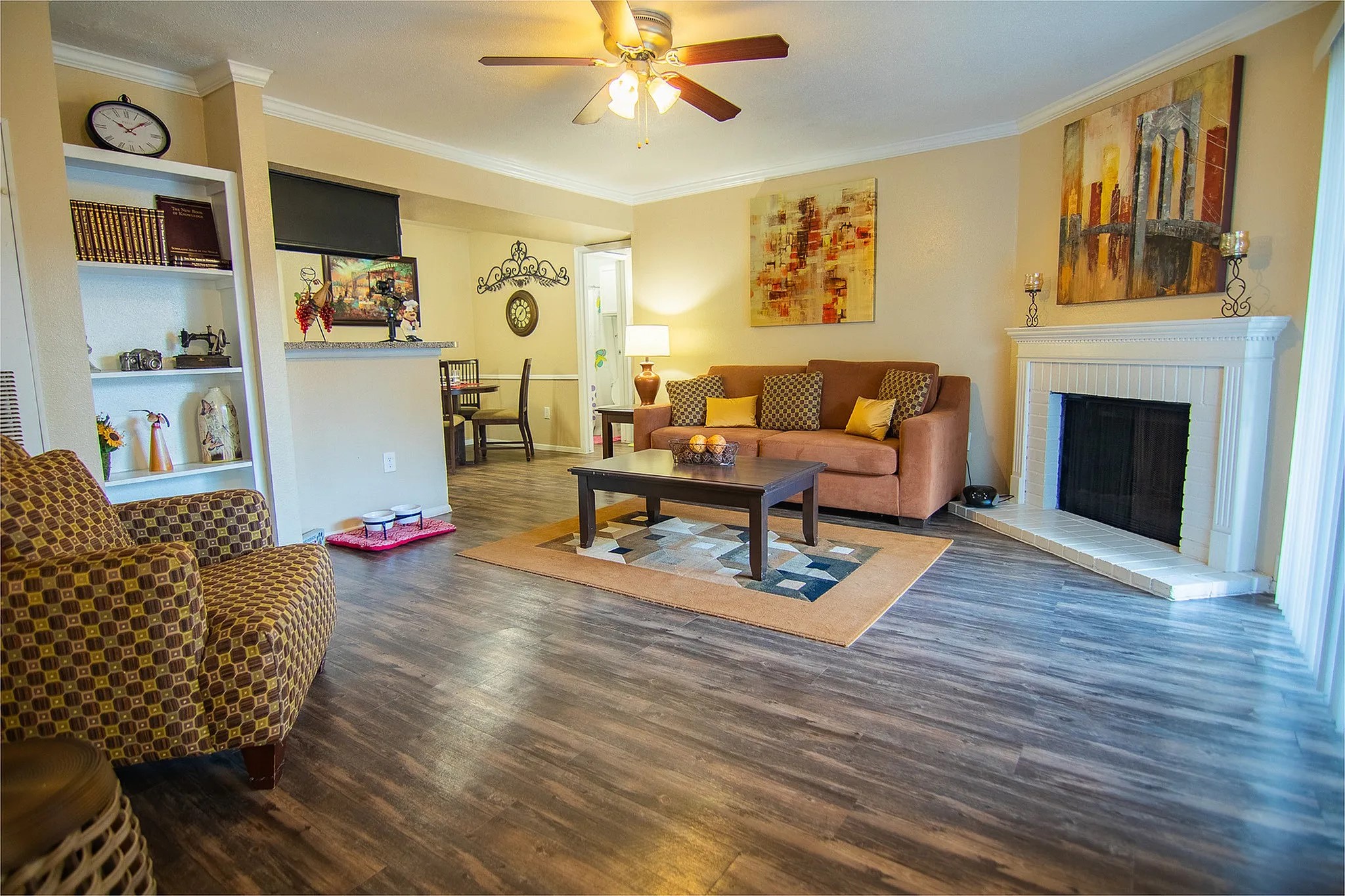 1230 Farm To Market 1960 Bypass Road East, Unit 802 Humble, TX 77338 - Photo 11 of 20 a living room with furniture and a fireplace