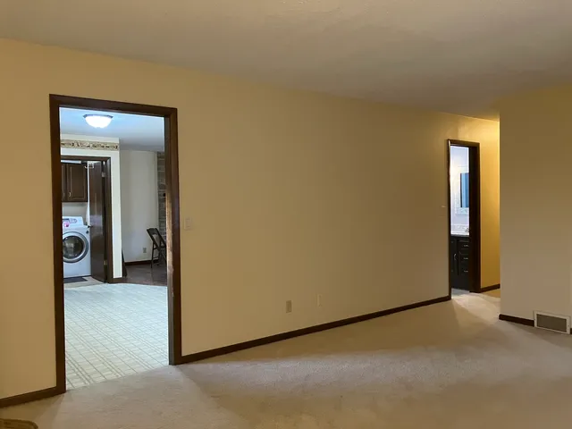 a view of a room with a hallway