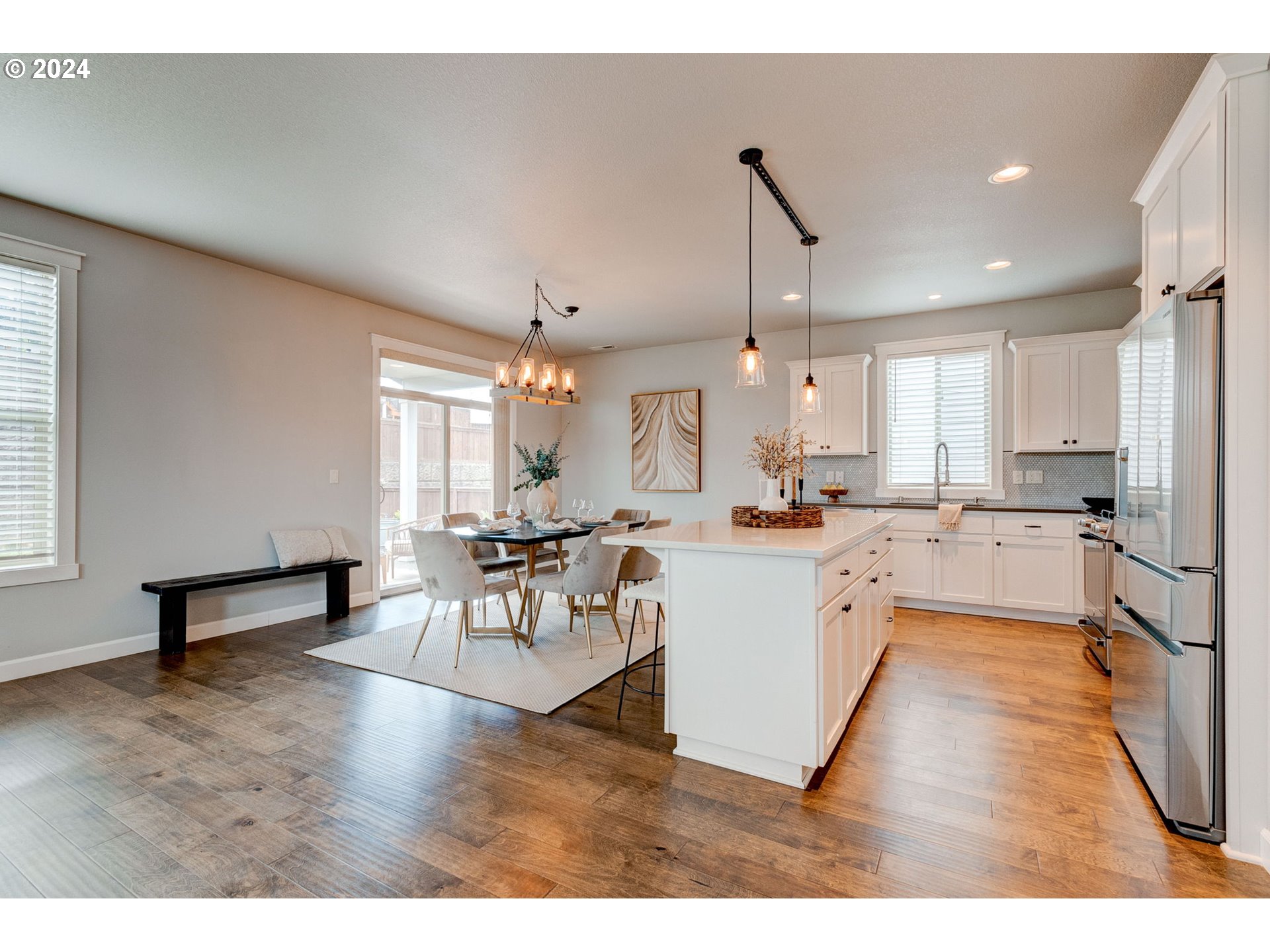 3293 North 10th Street Ridgefield, WA 98642 - Photo 13 of 47 a living room with stainless steel appliances kitchen island granite countertop furniture and a kitchen view