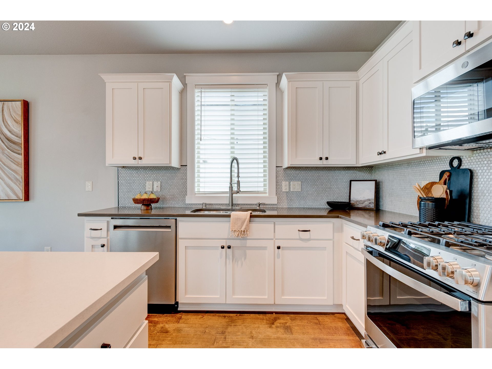 3293 North 10th Street Ridgefield, WA 98642 - Photo 17 of 47 a kitchen with cabinets appliances and a window