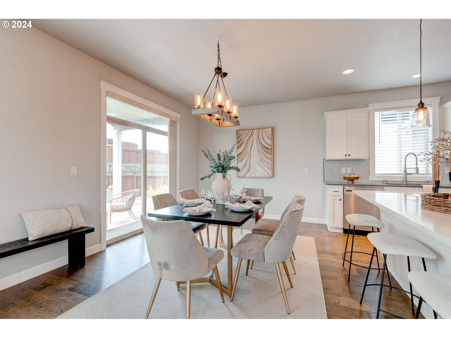3293 North 10th Street Ridgefield, WA 98642 - Photo 21 of 47 a dining room with furniture a chandelier and wooden floor