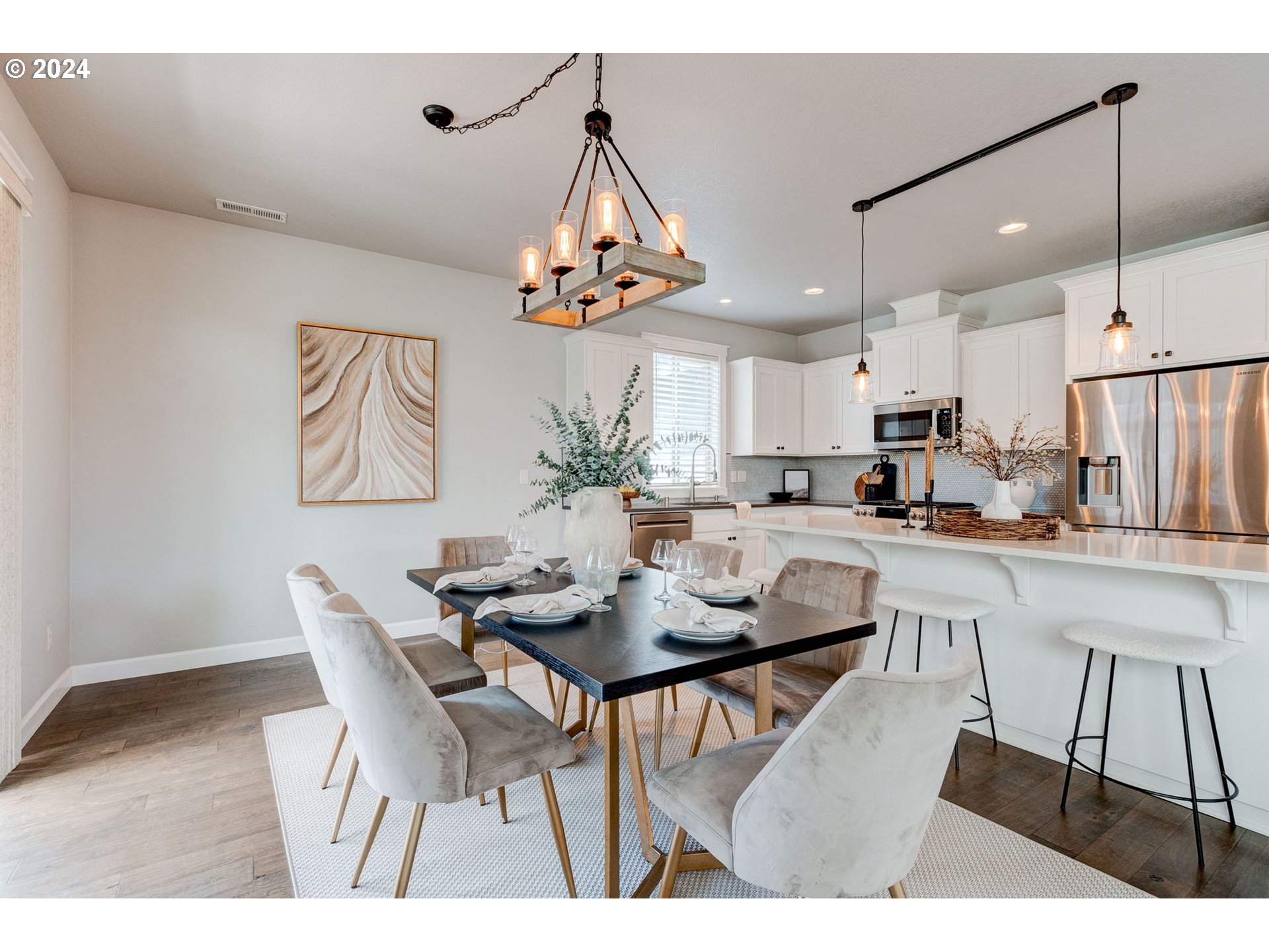 3293 North 10th Street Ridgefield, WA 98642 - Photo 22 of 47 a kitchen with a dining table and chairs