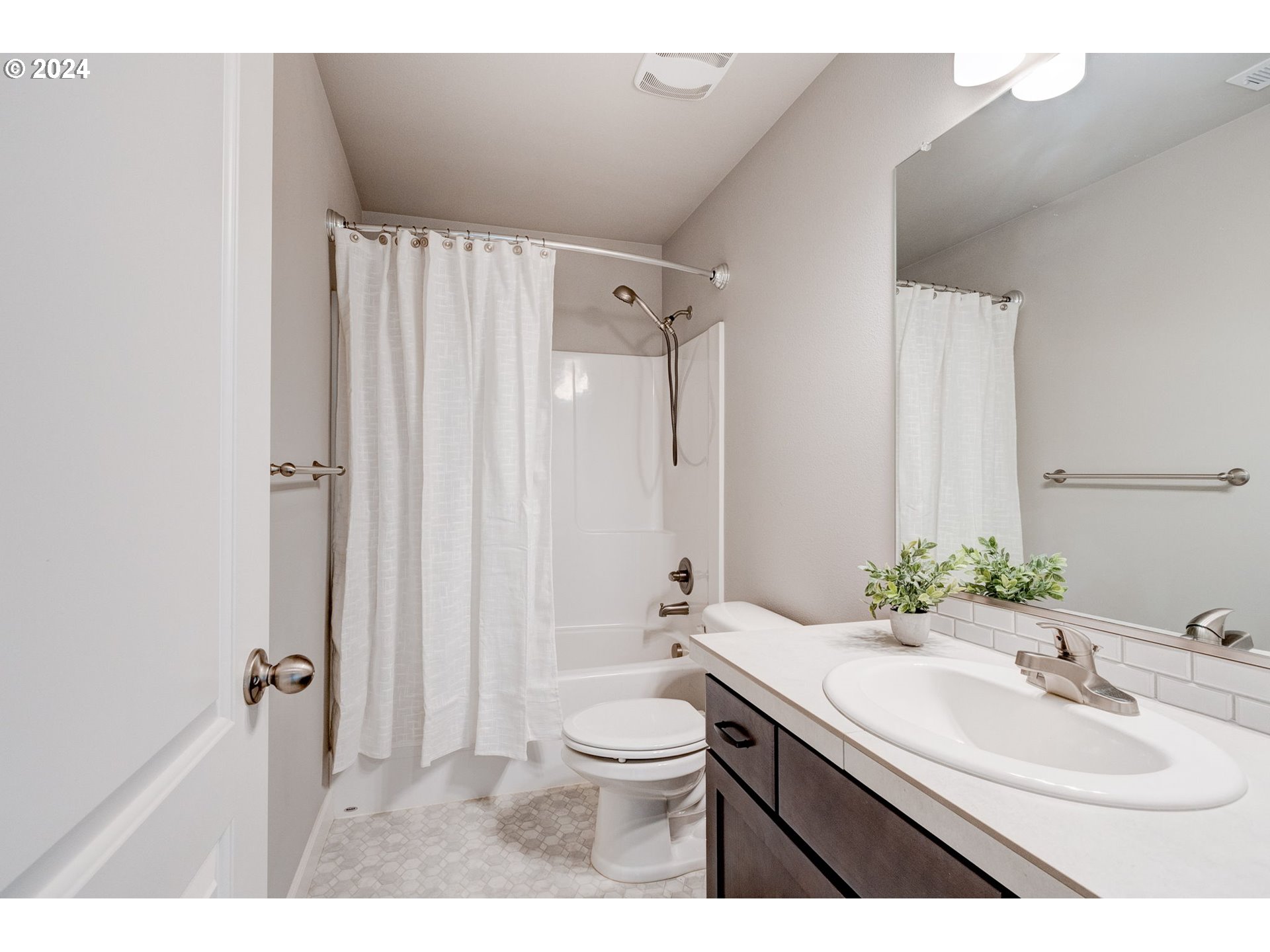 3293 North 10th Street Ridgefield, WA 98642 - Photo 28 of 47 a bathroom with a double vanity sink toilet mirror and shower