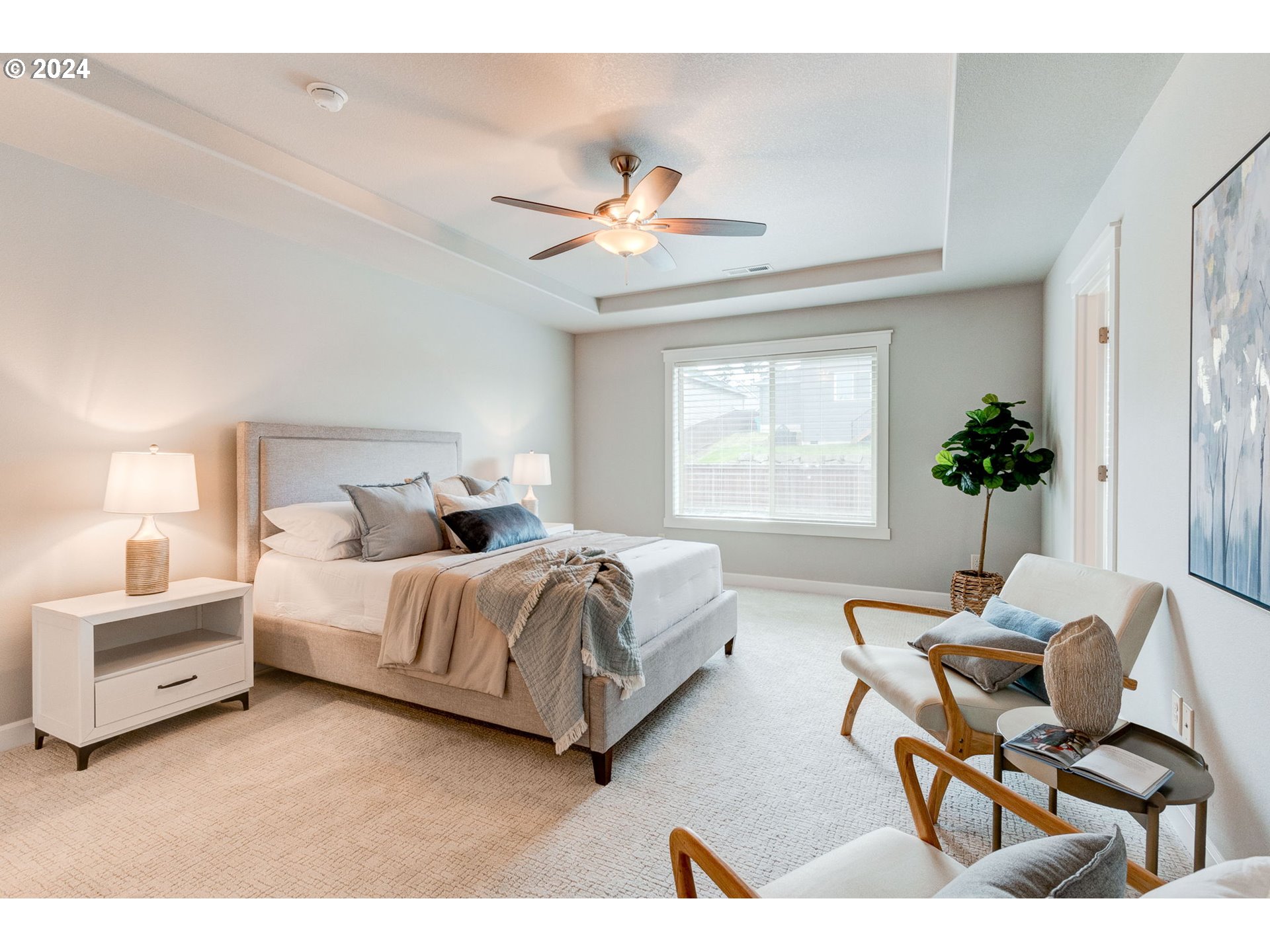 3293 North 10th Street Ridgefield, WA 98642 - Photo 30 of 47 a bedroom with a bed and a chandelier