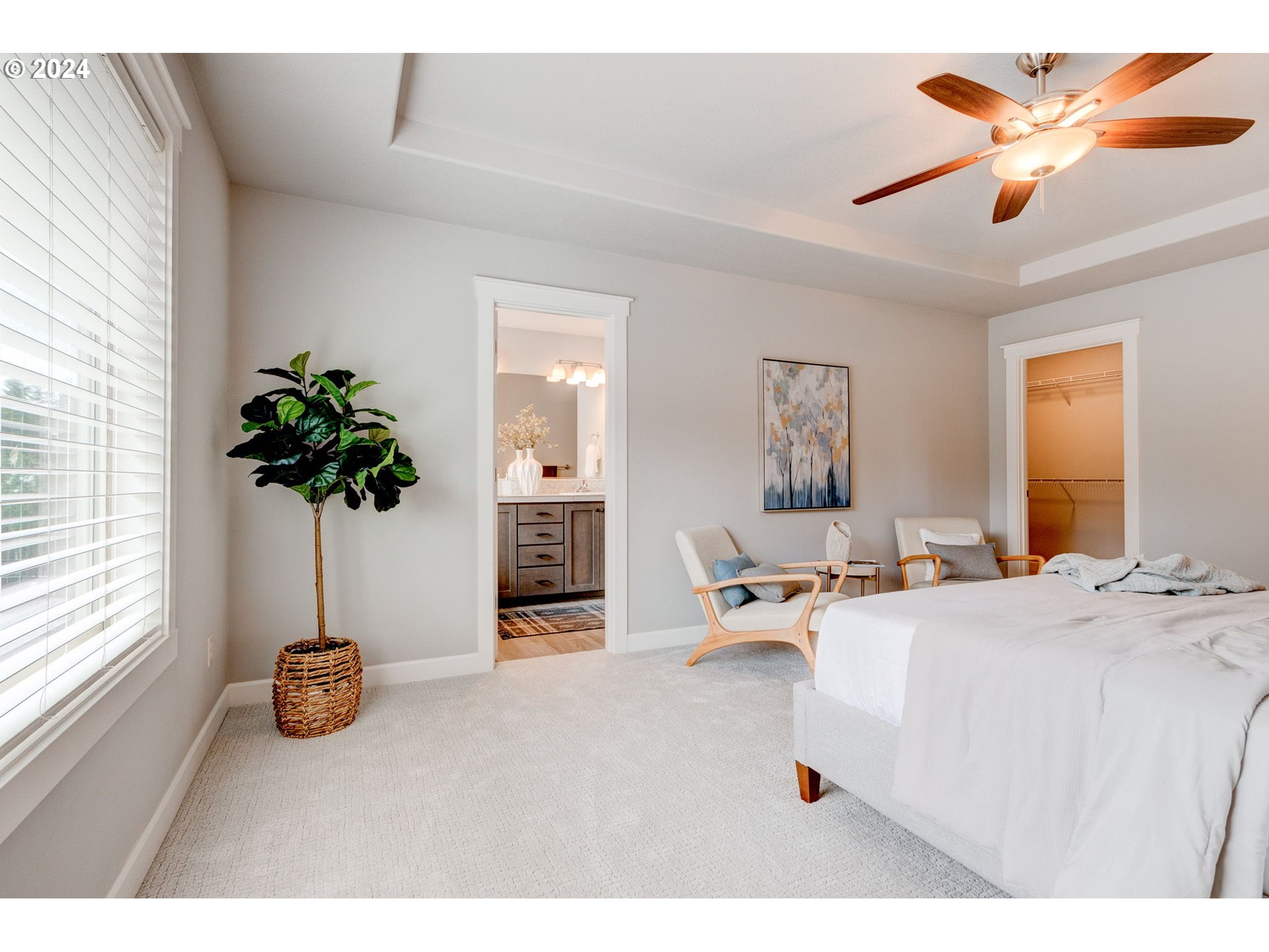 3293 North 10th Street Ridgefield, WA 98642 - Photo 31 of 47 a bedroom with furniture and a potted plant