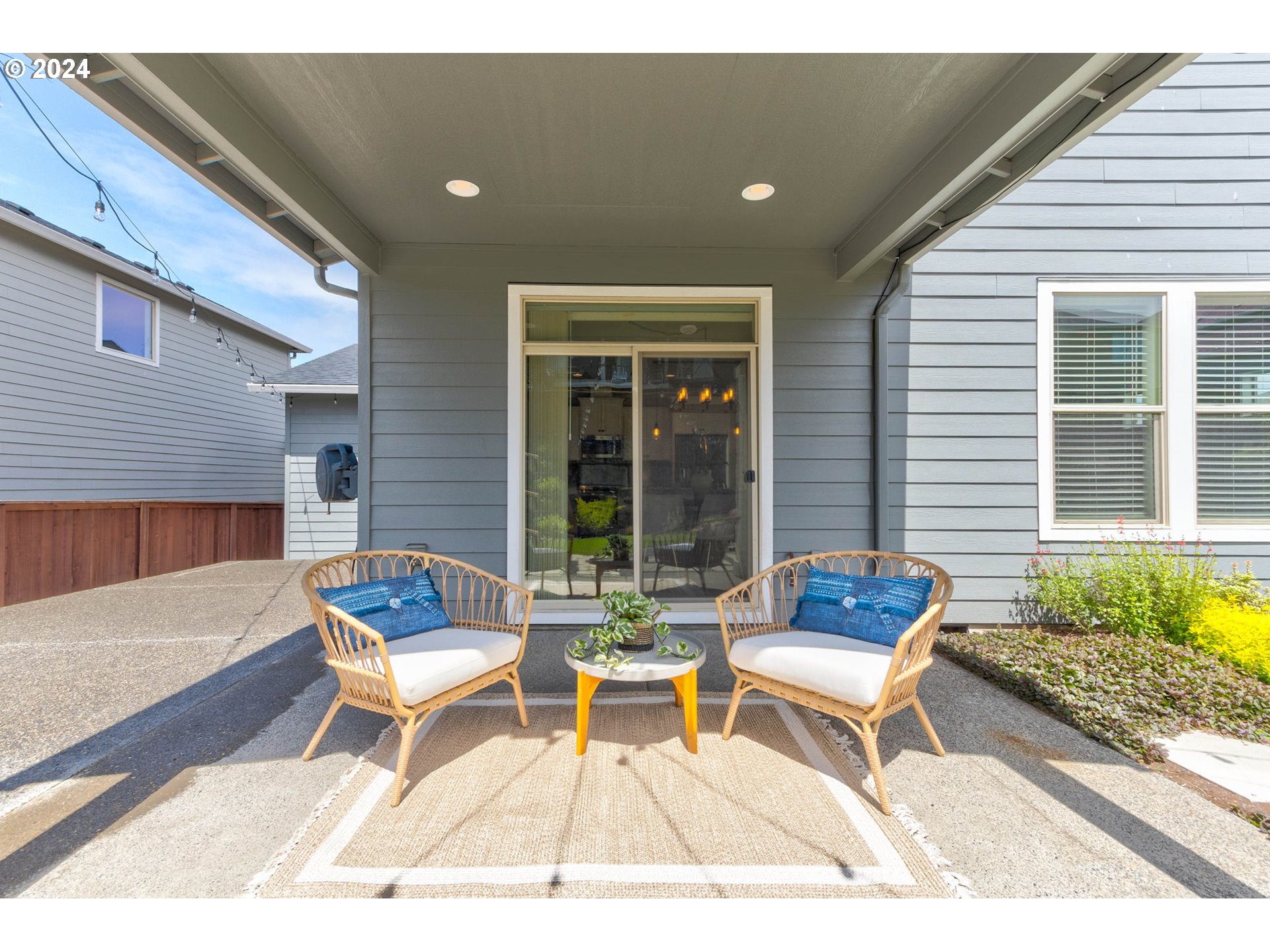 3293 North 10th Street Ridgefield, WA 98642 - Photo 40 of 47 a wooden bench sitting in front of a house
