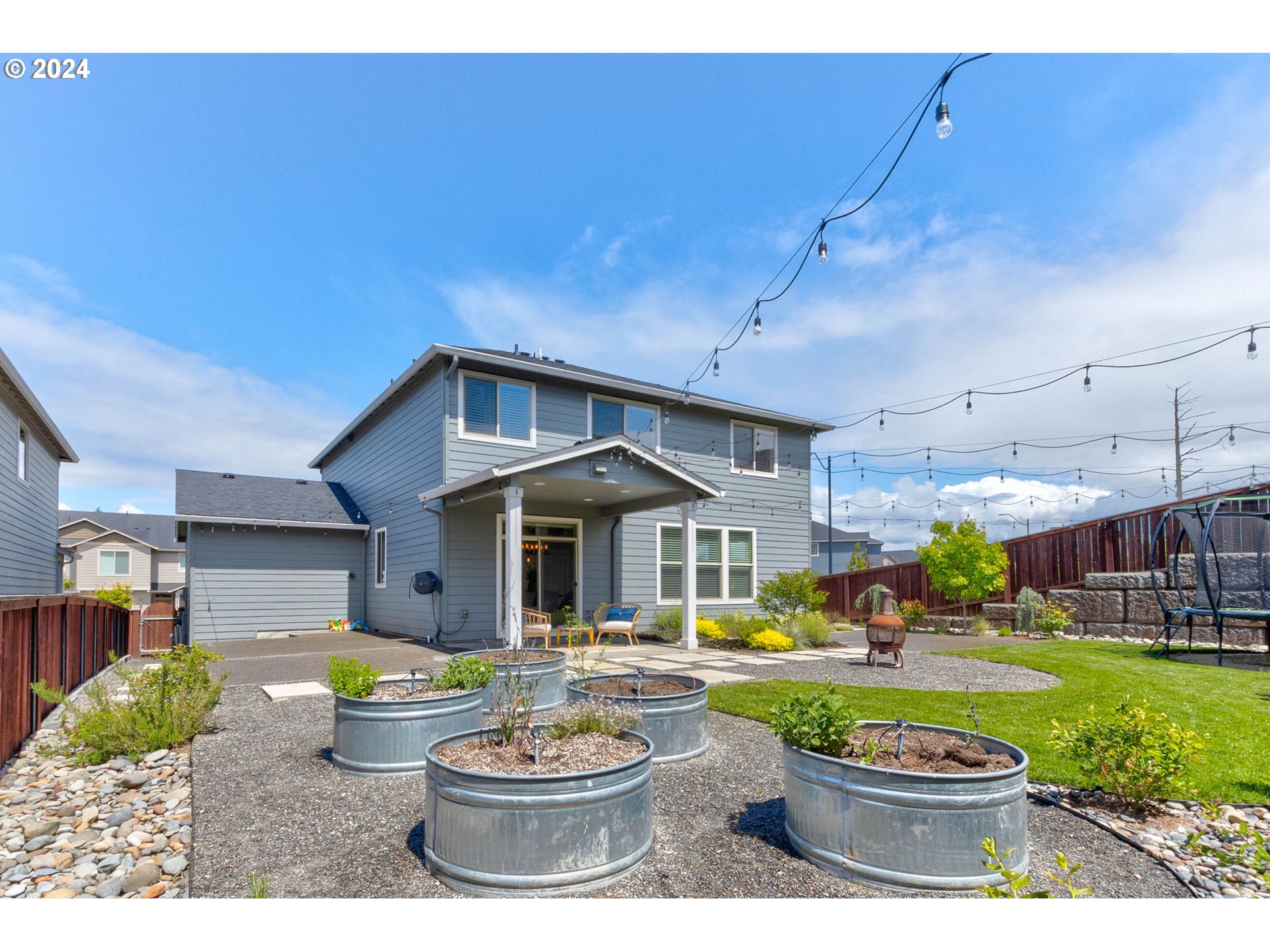 3293 North 10th Street Ridgefield, WA 98642 - Photo 41 of 47 a view of a patio with chair and tables