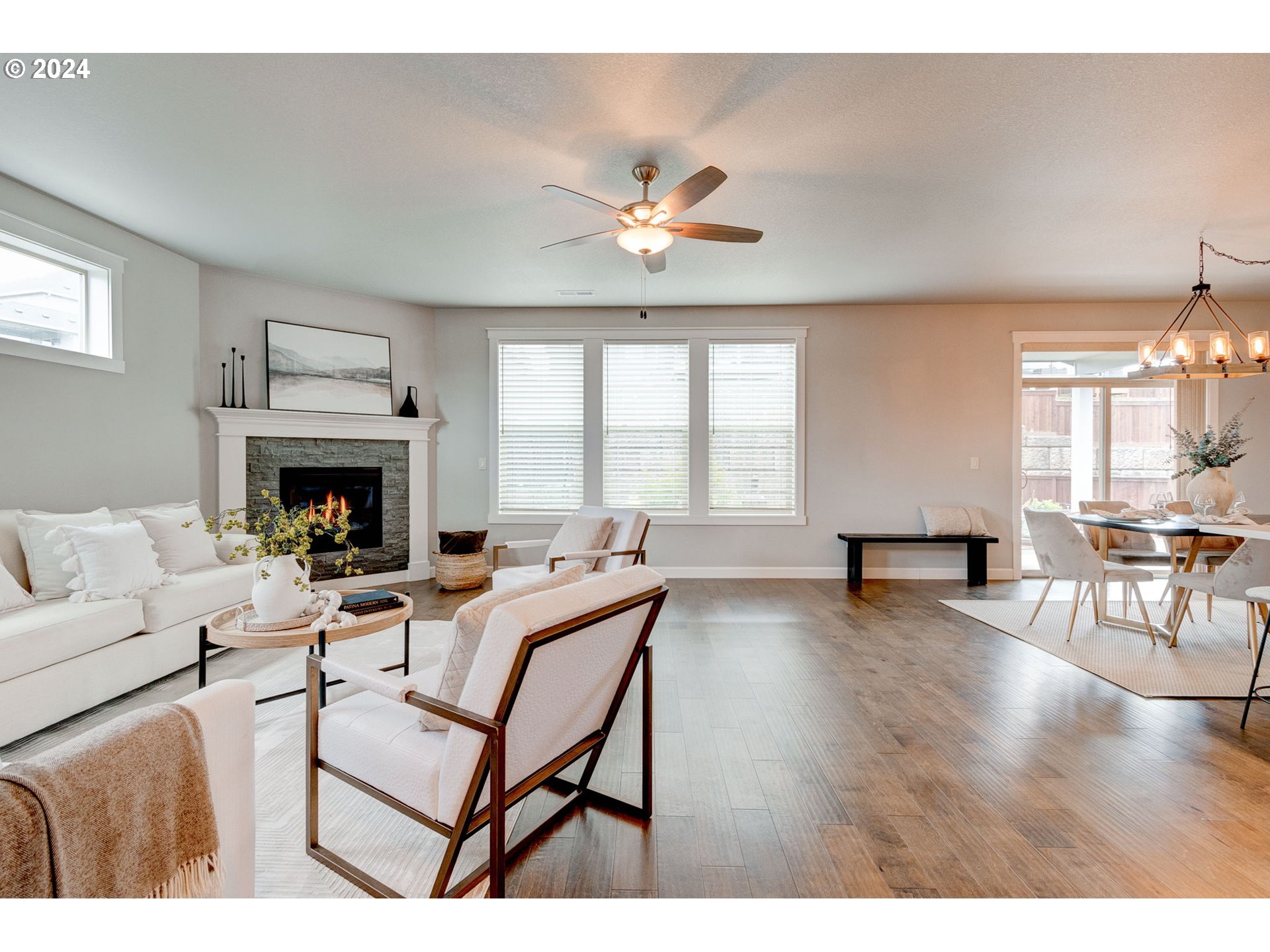 3293 North 10th Street Ridgefield, WA 98642 - Photo 8 of 47 a living room with furniture a fireplace and a large window