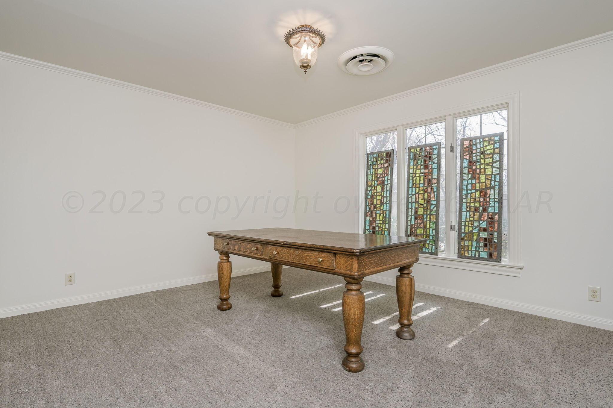 6513 Roxton Drive Amarillo, TX 79109 - Photo 24 of 29 a view of a room with a window and furniture