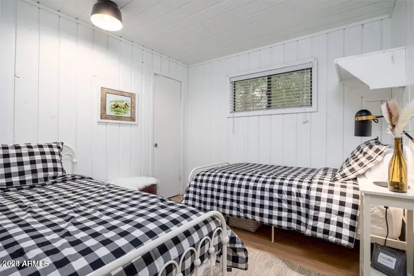 a bedroom with bed and a window