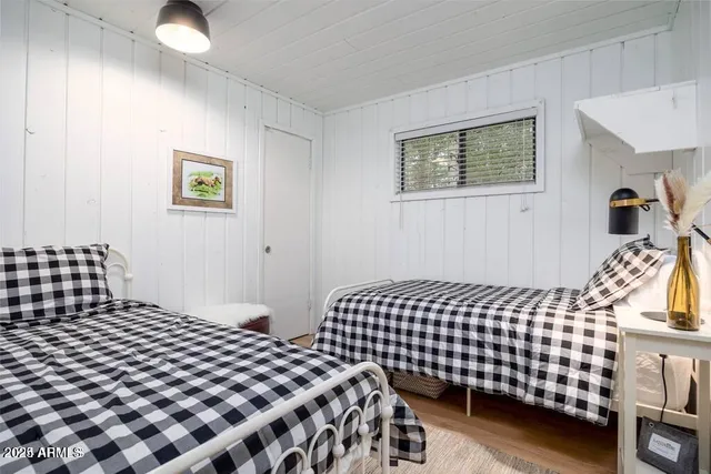 a bedroom with bed and a window