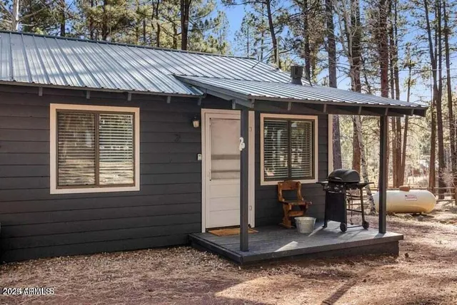a view of a patio with a table and chairs