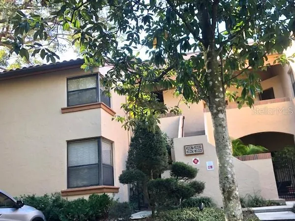 front view of a house with a tree