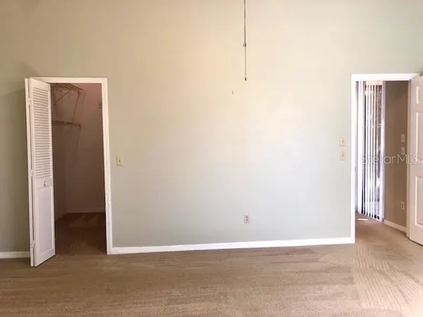 a view of a bathroom with tub and windows