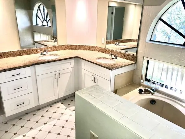 a view of a bathroom with a glass shower door