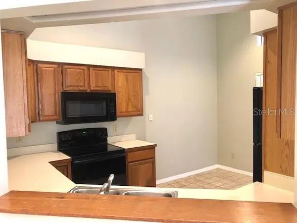a view of a balcony with wooden floor