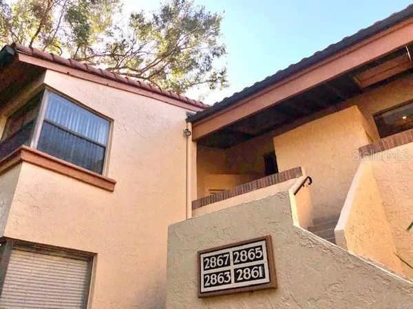 an aerial view of a house with outdoor space
