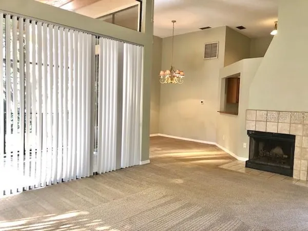 a view of a door with wooden floor and a window