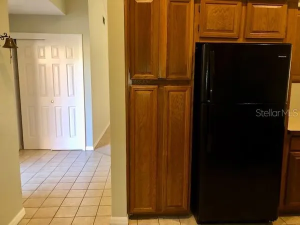 a view of a chandelier fan and fire place