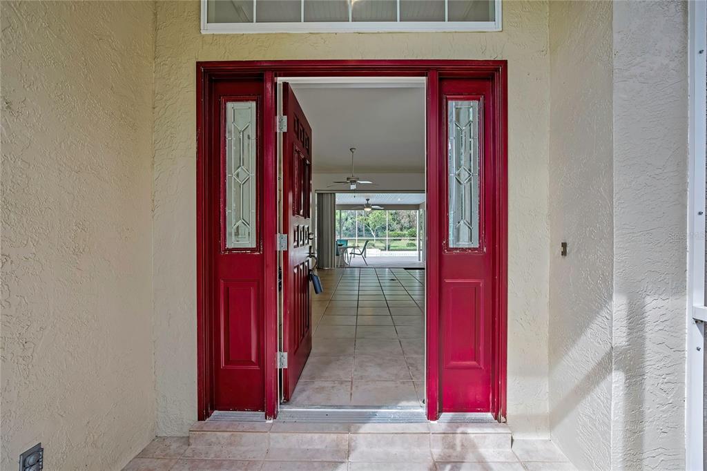3275 West Daffodil Drive Dunnellon, FL 34433 - Photo 12 of 67 a view of a red door of the house