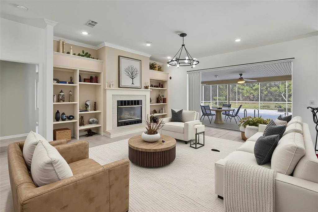 3275 West Daffodil Drive Dunnellon, FL 34433 - Photo 13 of 67 a living room with furniture and a fireplace