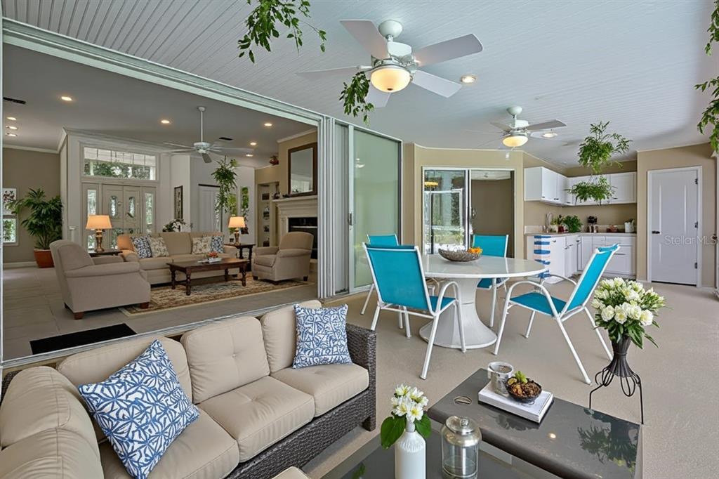 3275 West Daffodil Drive Dunnellon, FL 34433 - Photo 14 of 67 a living room with furniture a chandelier and kitchen view