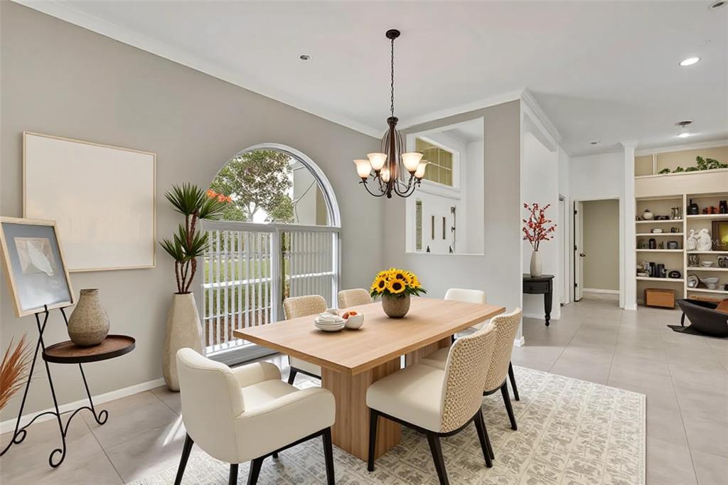 3275 West Daffodil Drive Dunnellon, FL 34433 - Photo 20 of 67 a view of a dining room with furniture a chandelier and wooden floor
