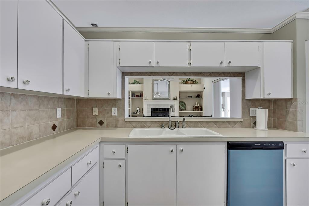 3275 West Daffodil Drive Dunnellon, FL 34433 - Photo 25 of 67 a kitchen with stainless steel appliances granite countertop a sink and cabinets