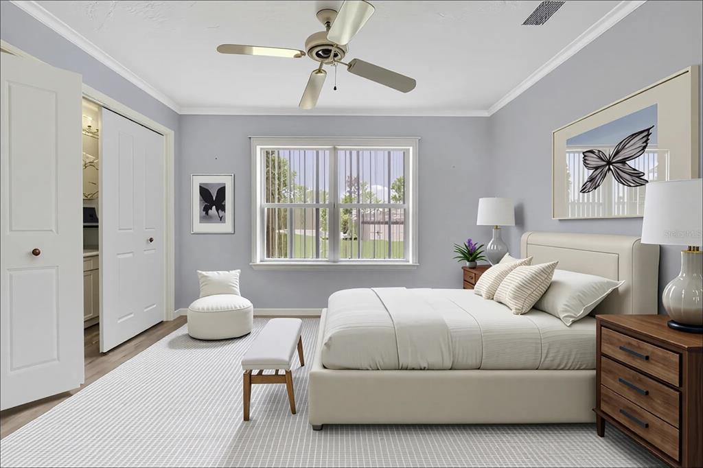 3275 West Daffodil Drive Dunnellon, FL 34433 - Photo 36 of 67 a bedroom with a bed a couch and a window