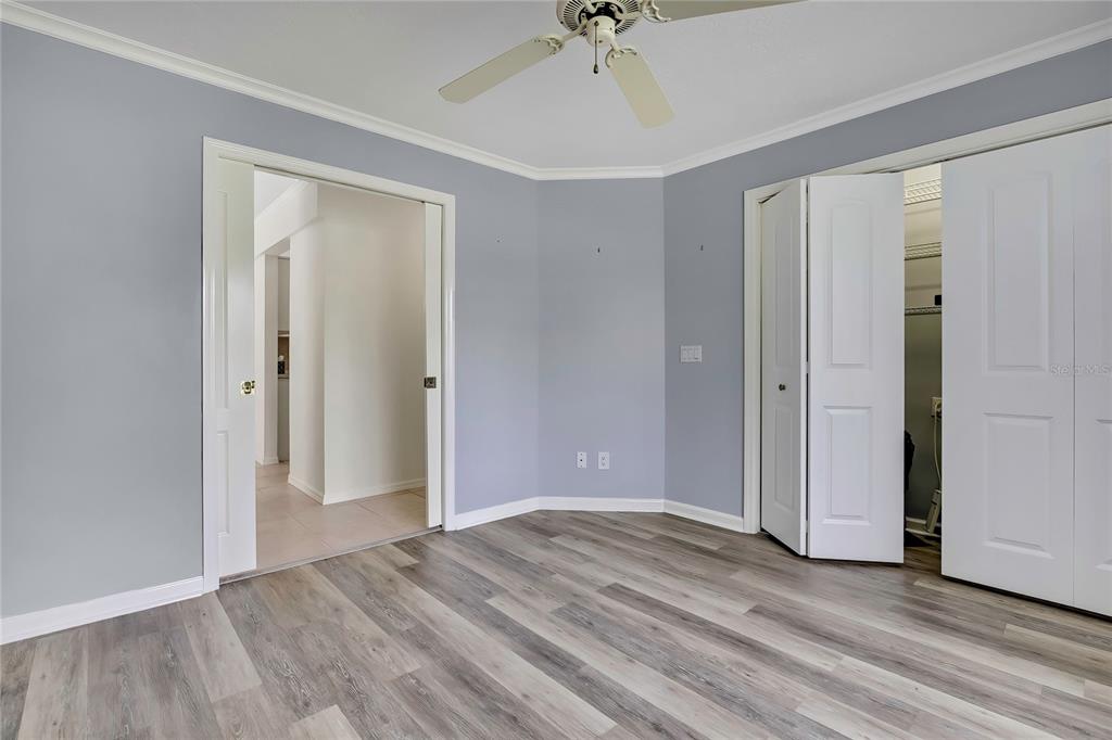 3275 West Daffodil Drive Dunnellon, FL 34433 - Photo 37 of 67 a view of a room with wooden floor and ceiling fan
