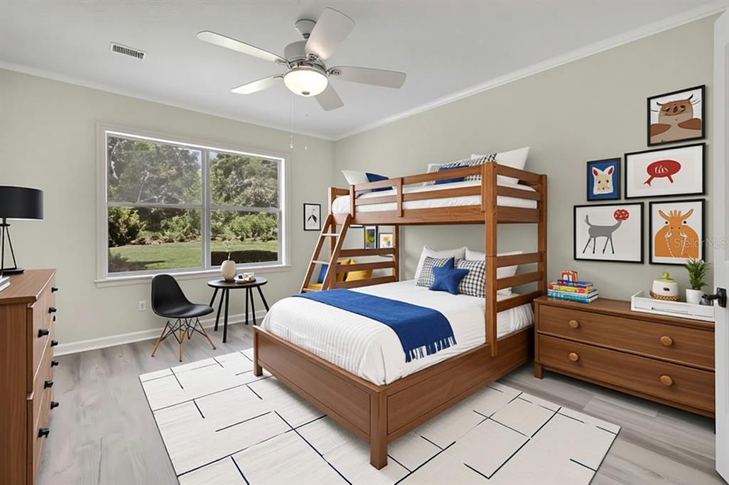 3275 West Daffodil Drive Dunnellon, FL 34433 - Photo 39 of 67 a bedroom with a bed and a large window