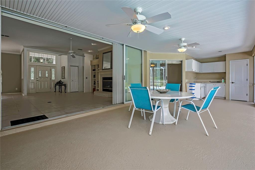 3275 West Daffodil Drive Dunnellon, FL 34433 - Photo 49 of 67 a view of a dining room with furniture and a chandelier