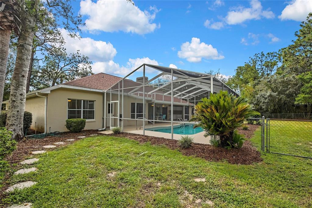 3275 West Daffodil Drive Dunnellon, FL 34433 - Photo 51 of 67 a view of a house with a yard