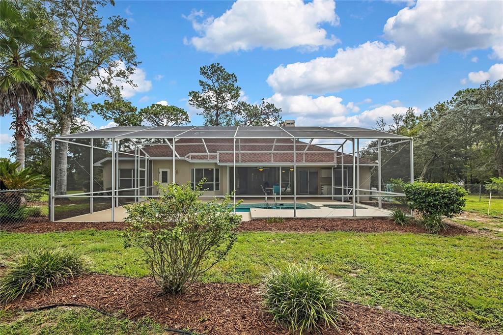 3275 West Daffodil Drive Dunnellon, FL 34433 - Photo 53 of 67 a view of a house with backyard porch and sitting area