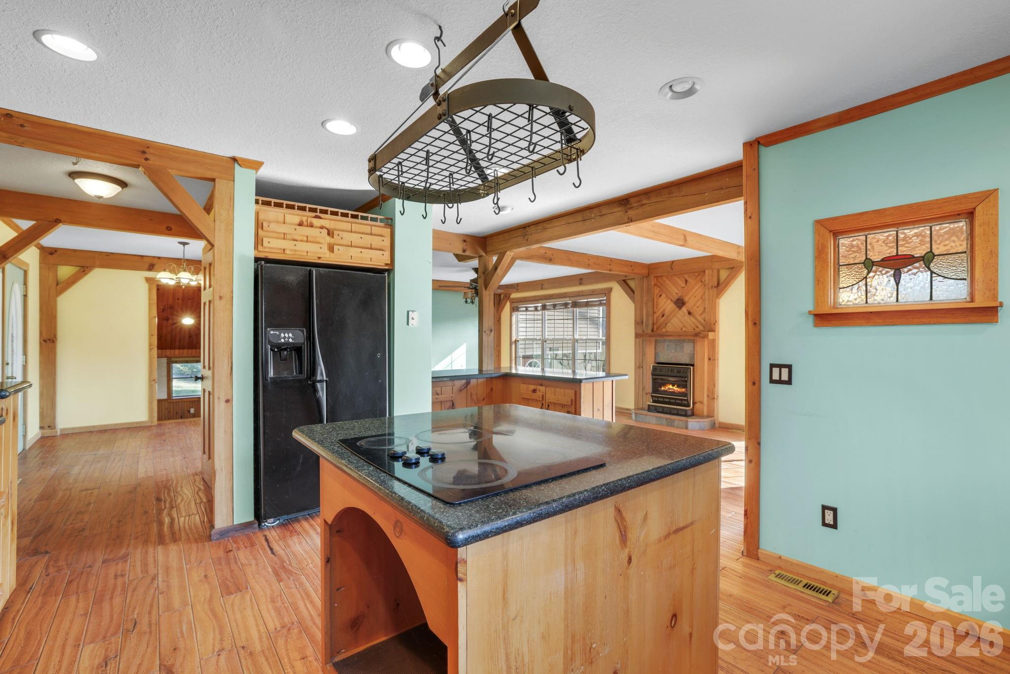 1644 West Deep Creek Road Bryson City, NC 28713 - Photo 11 of 47 a kitchen with stainless steel appliances granite countertop a sink and a wooden cabinets