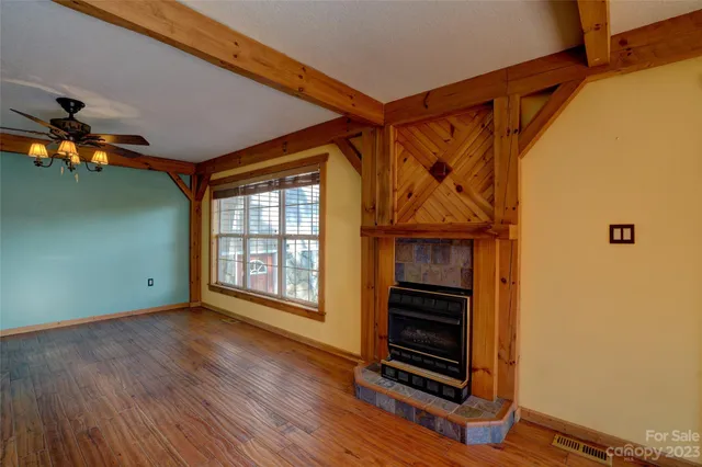 a view of a room with wooden floor and stairs