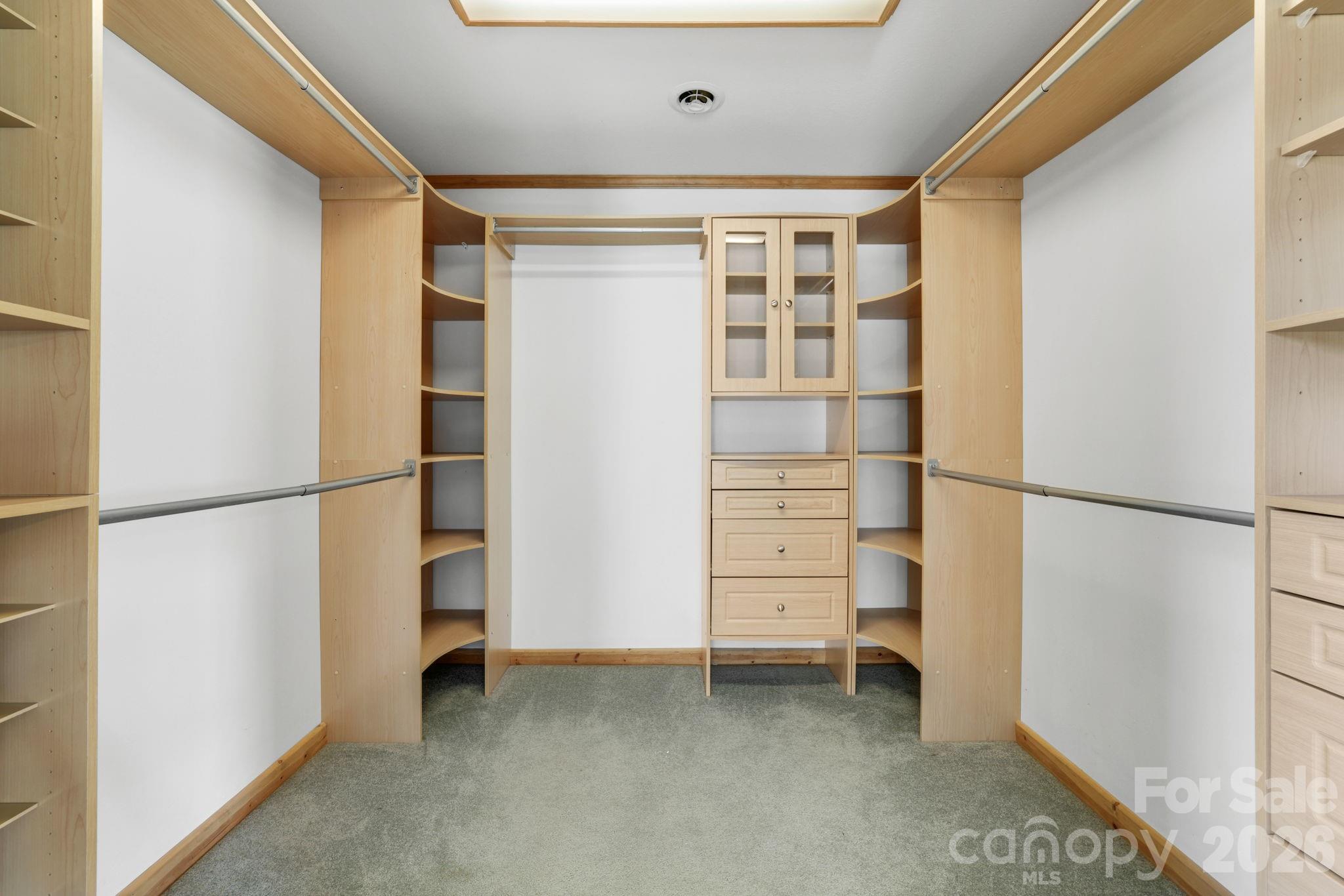 1644 West Deep Creek Road Bryson City, NC 28713 - Photo 16 of 47 a view of walk in closet with empty racks