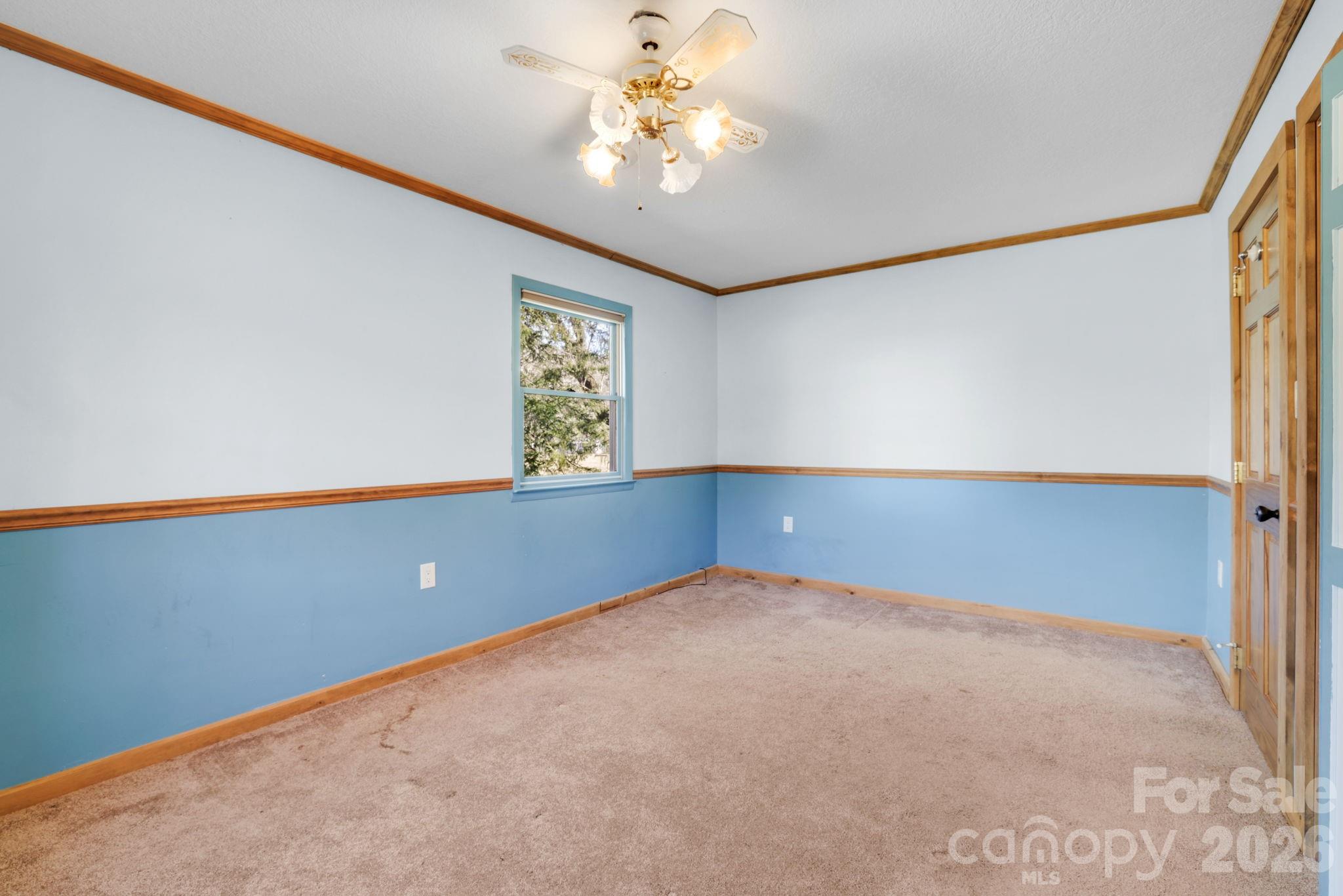 1644 West Deep Creek Road Bryson City, NC 28713 - Photo 21 of 47 an empty room with windows and fan