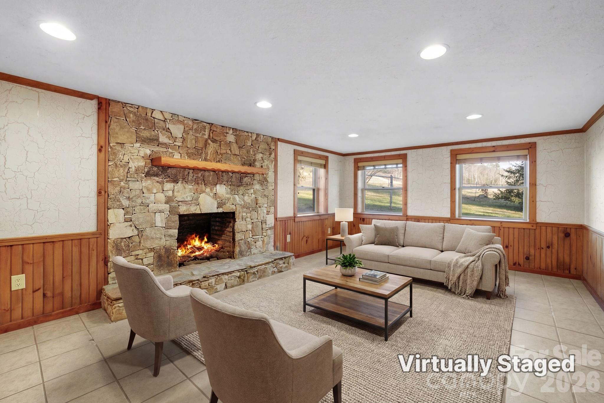 1644 West Deep Creek Road Bryson City, NC 28713 - Photo 24 of 47 a living room with furniture and a fireplace