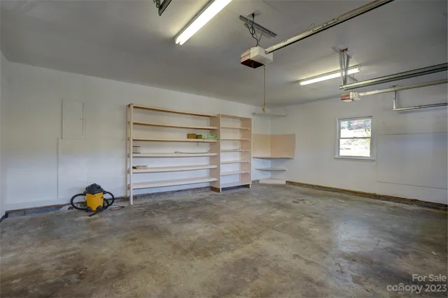 a yellow house with trees in front of it