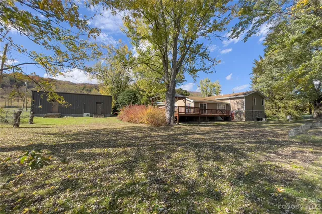a view of the house with a yard