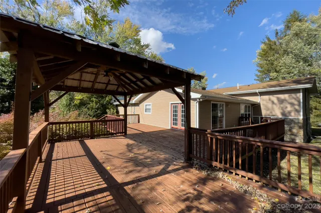 a small pool with a tree in the background